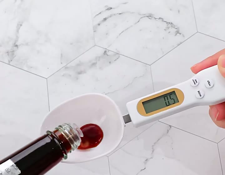 PrecisionSpoon weighing ingredients on a kitchen counter